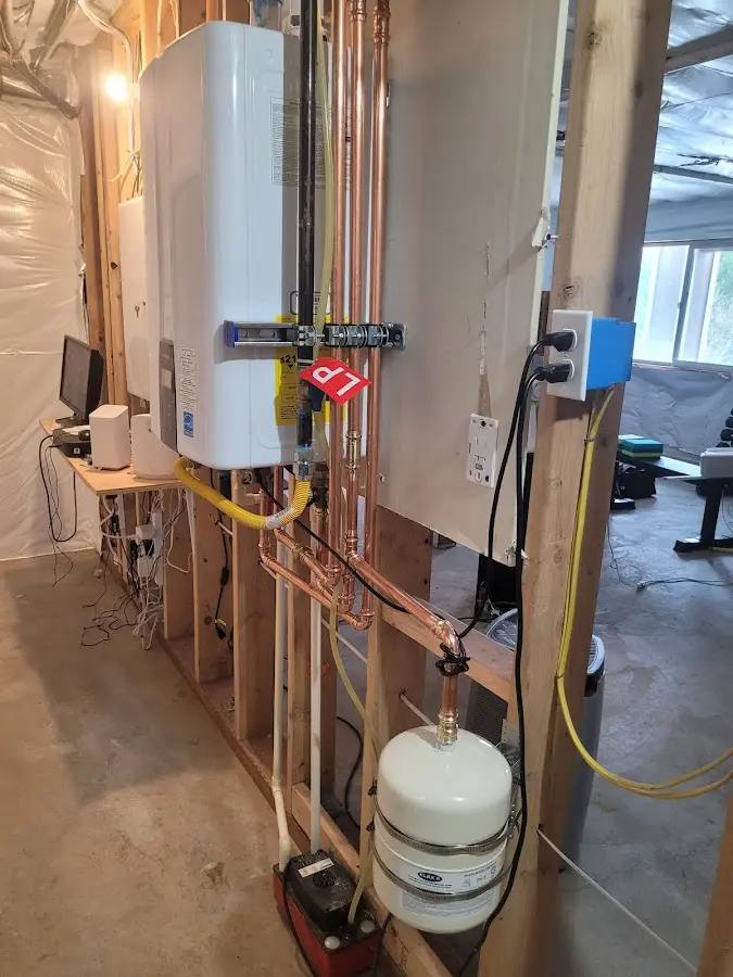 Licensed plumber repairing a kitchen sink in Kelso